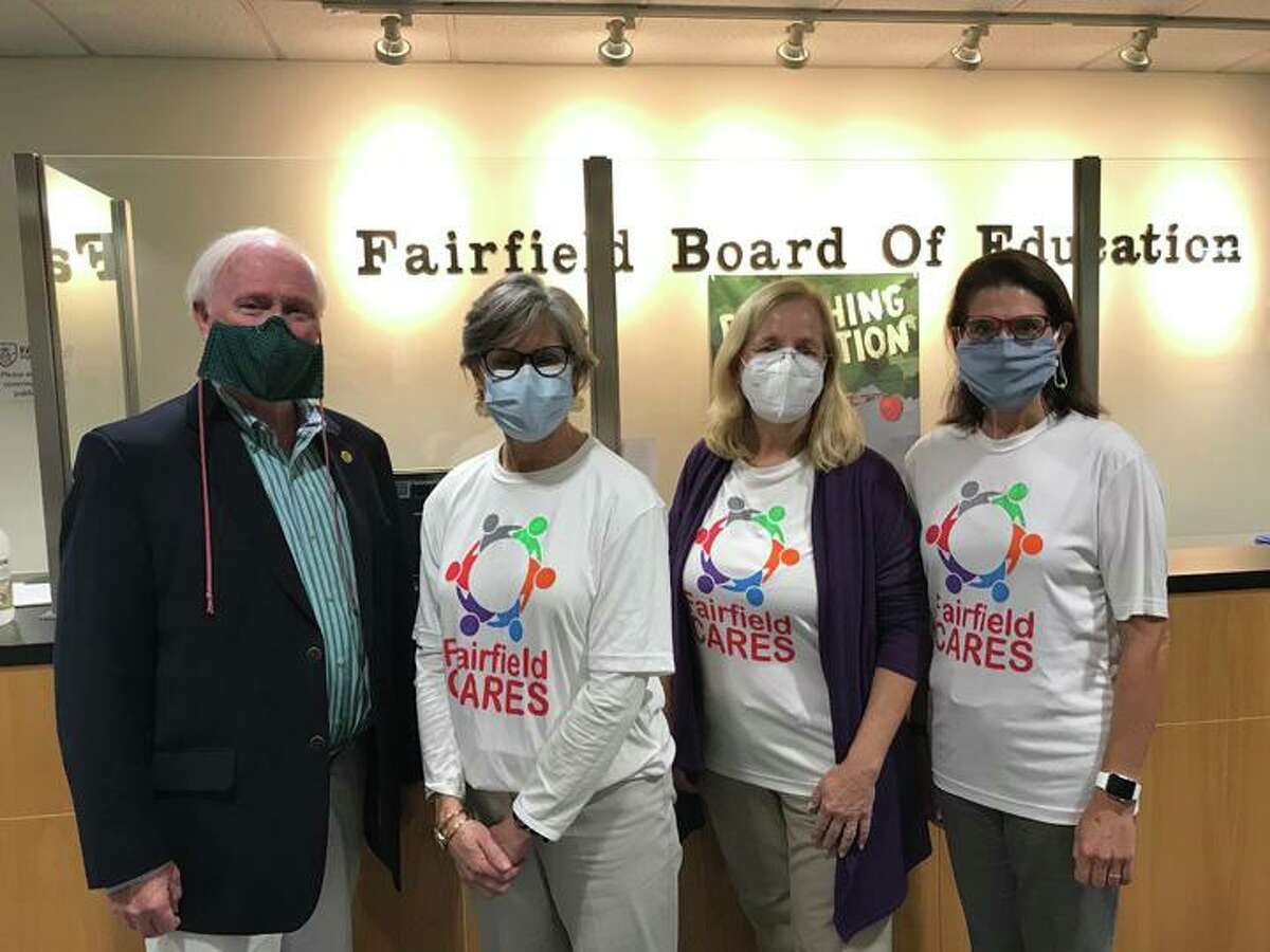 Left to right: Coalition members Phil Dwyer, Cathy Hazlett, Reini Knorr and Cristin McCarthy Vahey are all smiles behind their safety masks after the Fairfield Board of Education unanimously voted to accept the CDC Drug Free Communities Grant.