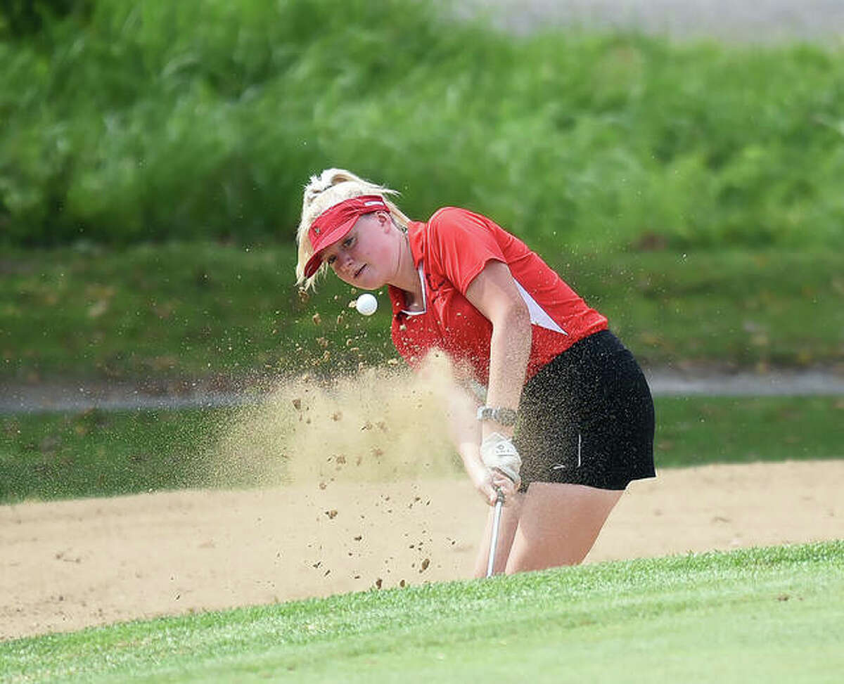 Alton’s Alexia Paulin hits out of the bunker on No. 4 at Oak Brook Golf Club during the Class 3A Edwardsville Regional on Thursday.