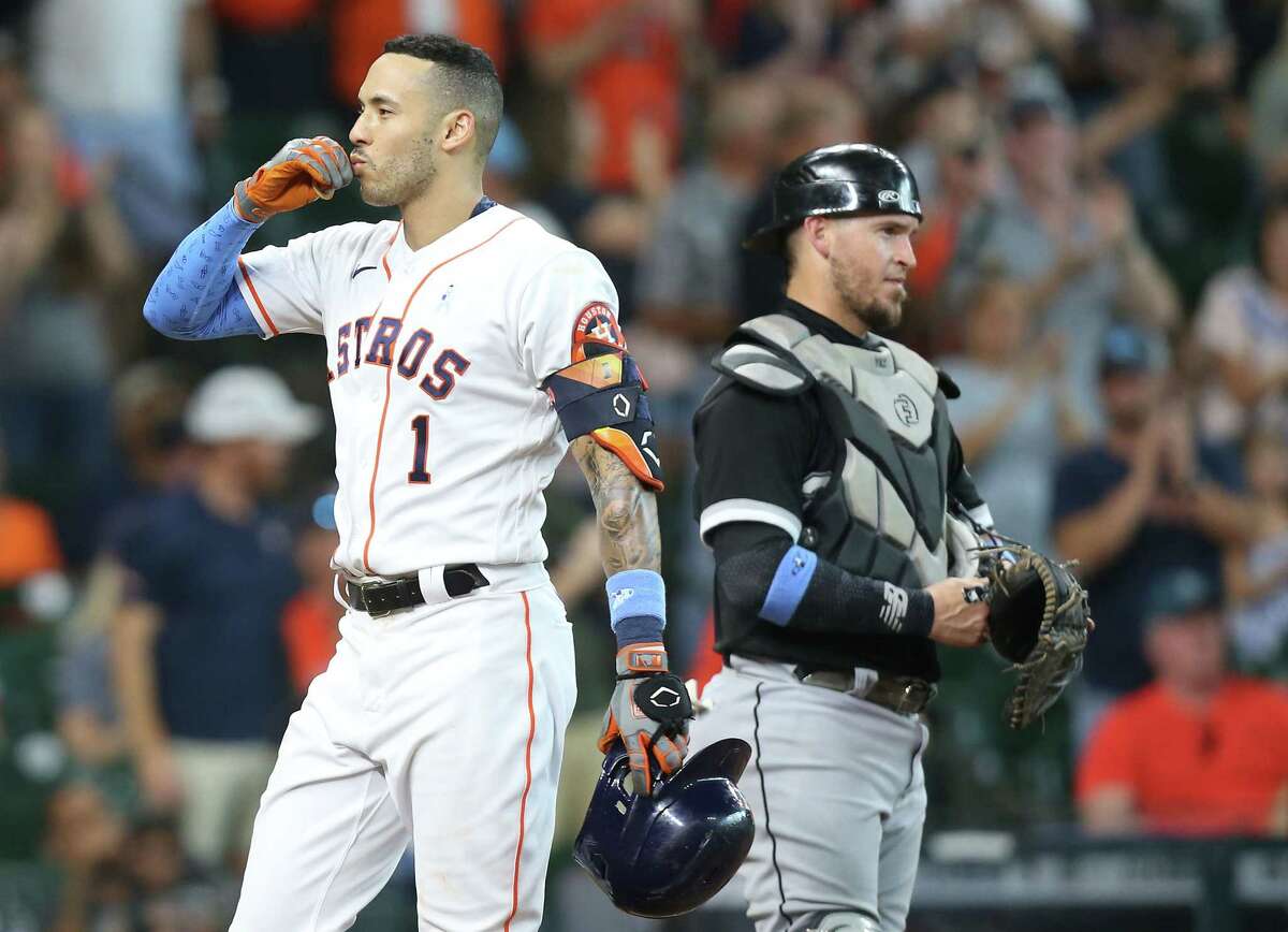 Houston Astros shortstop Carlos Correa (1) blows a kiss into the stands after running is a solo home run against Chicago White Sox in the fourth inning at Minute Maid Park in Houston on Sunday, June 20, 2021.