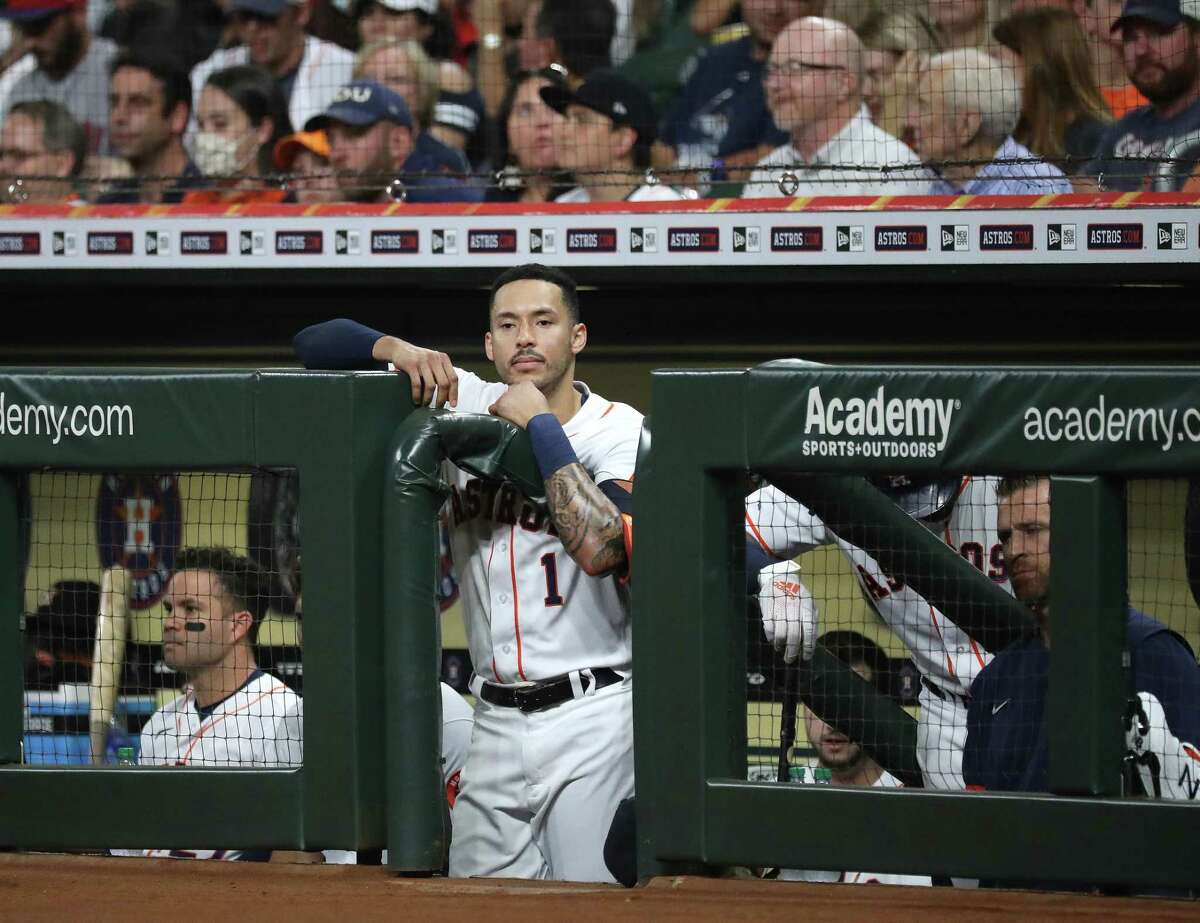 Houston Astros Carlos Correa (1) in the dugout during the first inning of an MLB baseball game at Minute Maid Park, Tuesday, September 28, 2021, in Houston.
