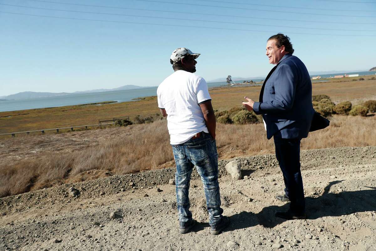 Richard Treiber (right) chats with equity partner Robert Livingston as they visit the site of a planned cannabis development.