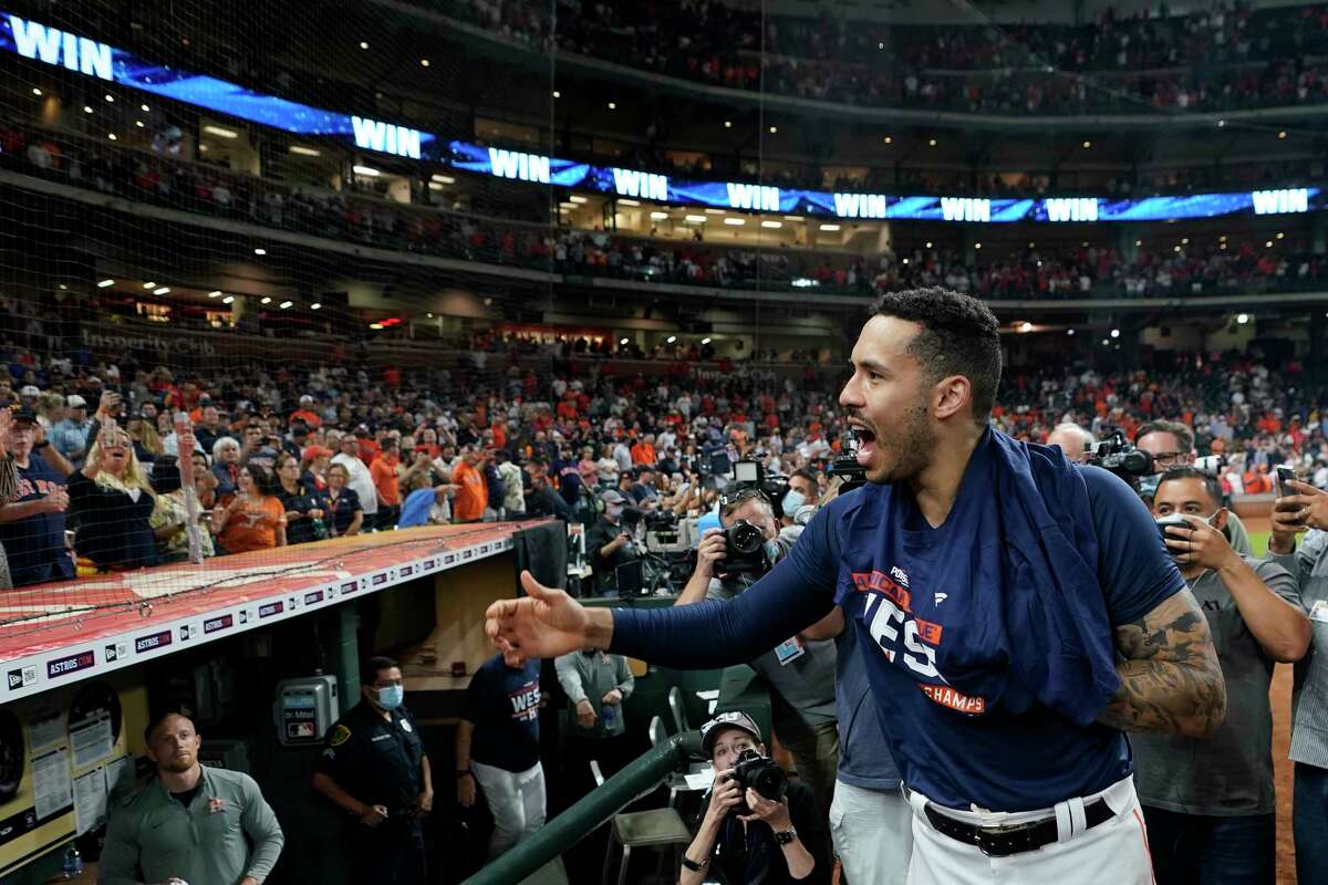 Houston Astros' shortstop Carlos Correa celebrates with fans after beating the Rays and clinching another American League West title on Thursday, Sept. 30, 2021 at Minute Maid Park.