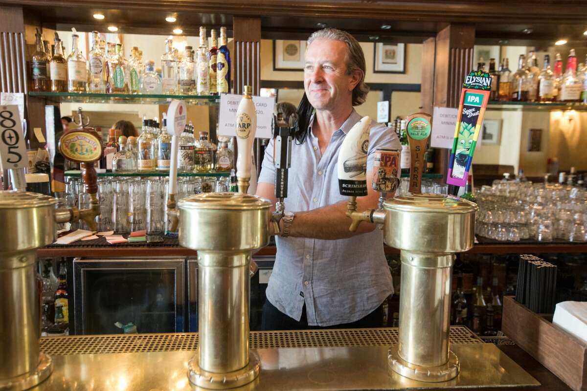 Mick Graham, co-owner of Maggie McGarry's, pours himself a pint behind the bar on September 28, 2021 in San Francisco.