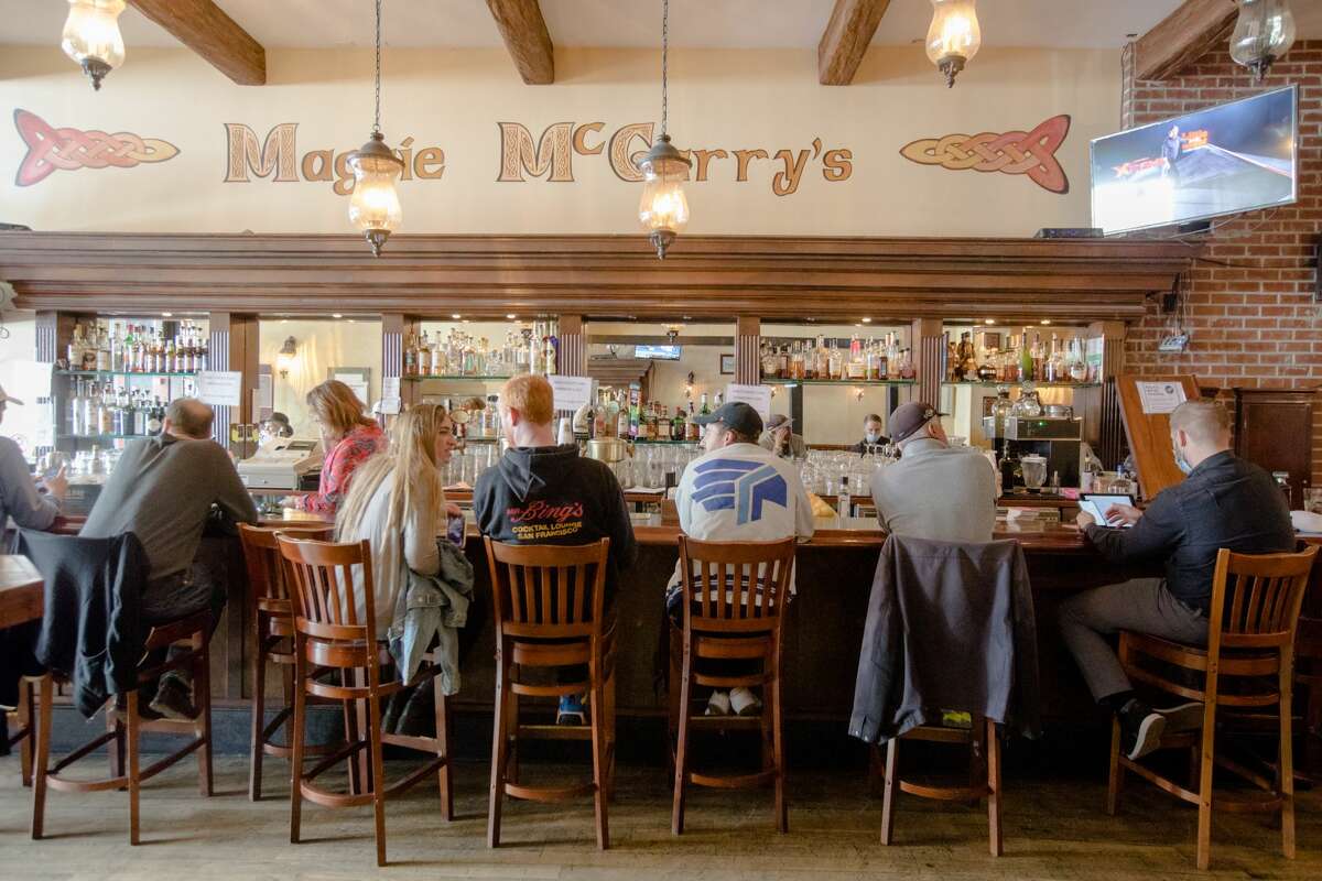 Customers sit at the bar at Maggie McGarry's in San Francisco, Calif., on Sept. 28, 2021.