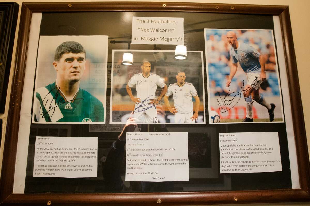 A poster in the back of the bar shows the three footballers who are not welcome at Maggie McGarry's in San Francisco on September 28, 2021.