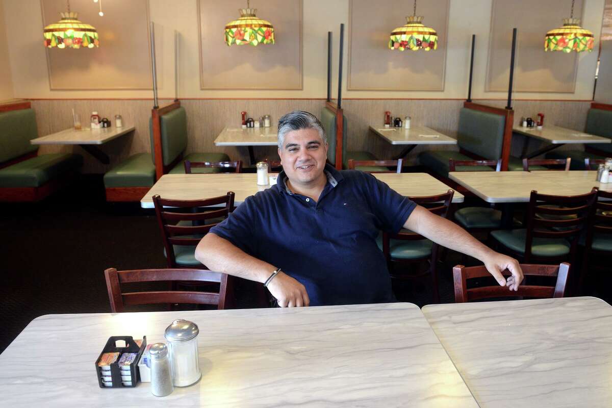 Owner Nick Roussas in the dining room at Frankie’s Diner, in Bridgeport, Conn. Sept. 30, 2021.