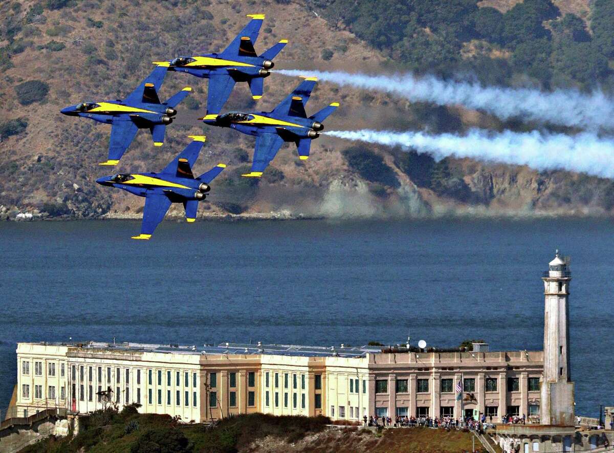 The Blue Angels practice their aerial maneuvers over Alcatraz Island and the San Francisco Bay, as seen from the Fairmont Hotel in San Francisco on Oct. 10, 2019.