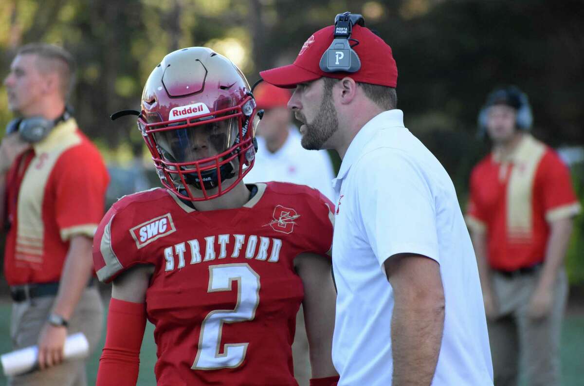 Stratford coach Nathan Tyler talks to quarterback Joseph Booska during a football game between Bridgeport Central and Stratford at Penders Field, Stratford on Friday, Oct. 1, 2021.