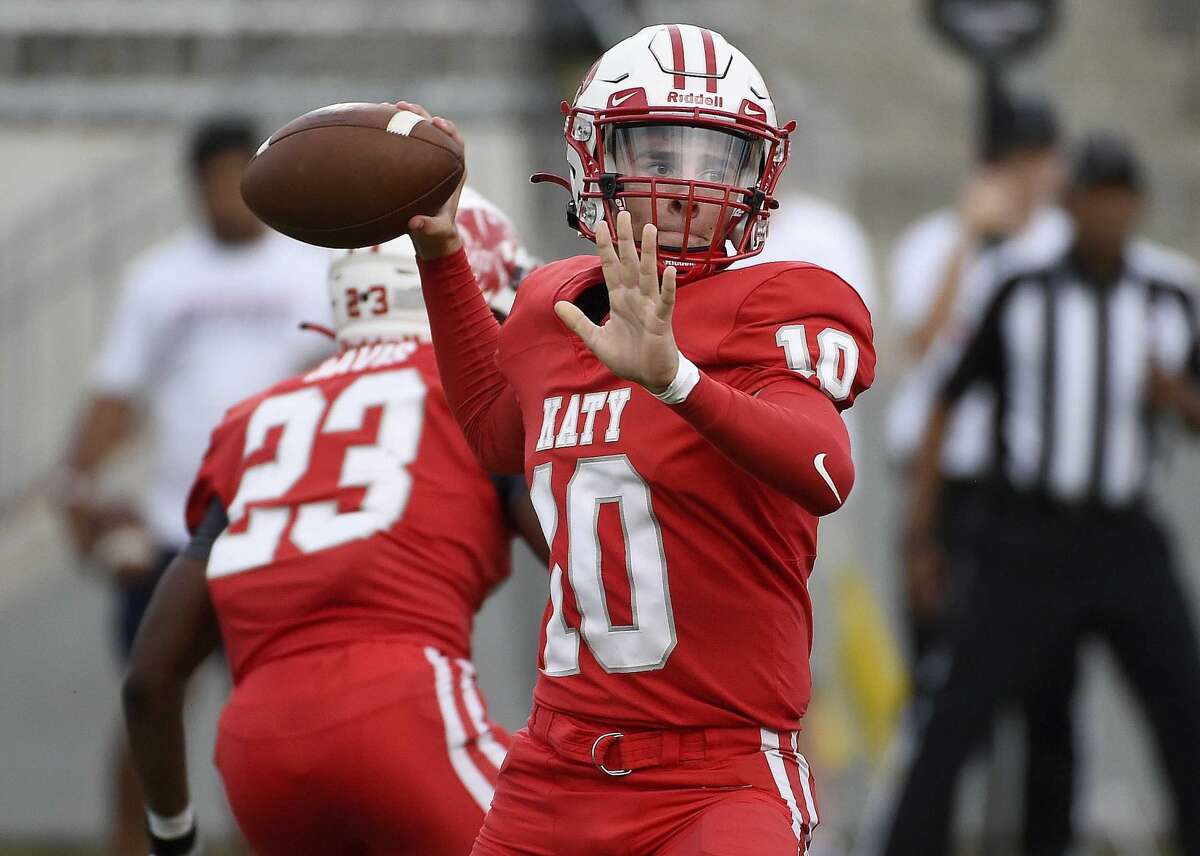 Katy quarterback Caleb Koger throws a pass during the first half of a high school football game against Tompkins, Friday, Oct. 1, 2021, in Katy.