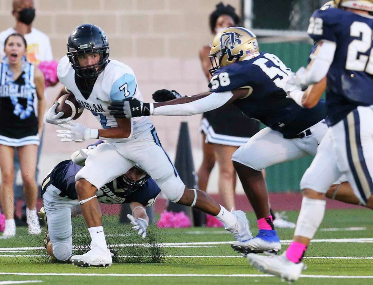 O'Connor's Jacob Gonzales (07) tries to run from the grasp of O'Connor's Isaac Dadzie (58) during their football game at Farris Stadium on Friday, Oct. 1, 2021.