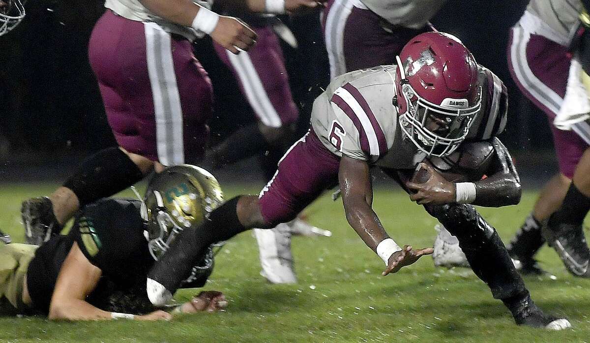 Little Cypress-Mauriceville's Da'Marion Morris tries to break away from Jasper's defense during Friday's game at LC-M. Photo made Friday, October 1, 2021 Kim Brent/The Enterprise