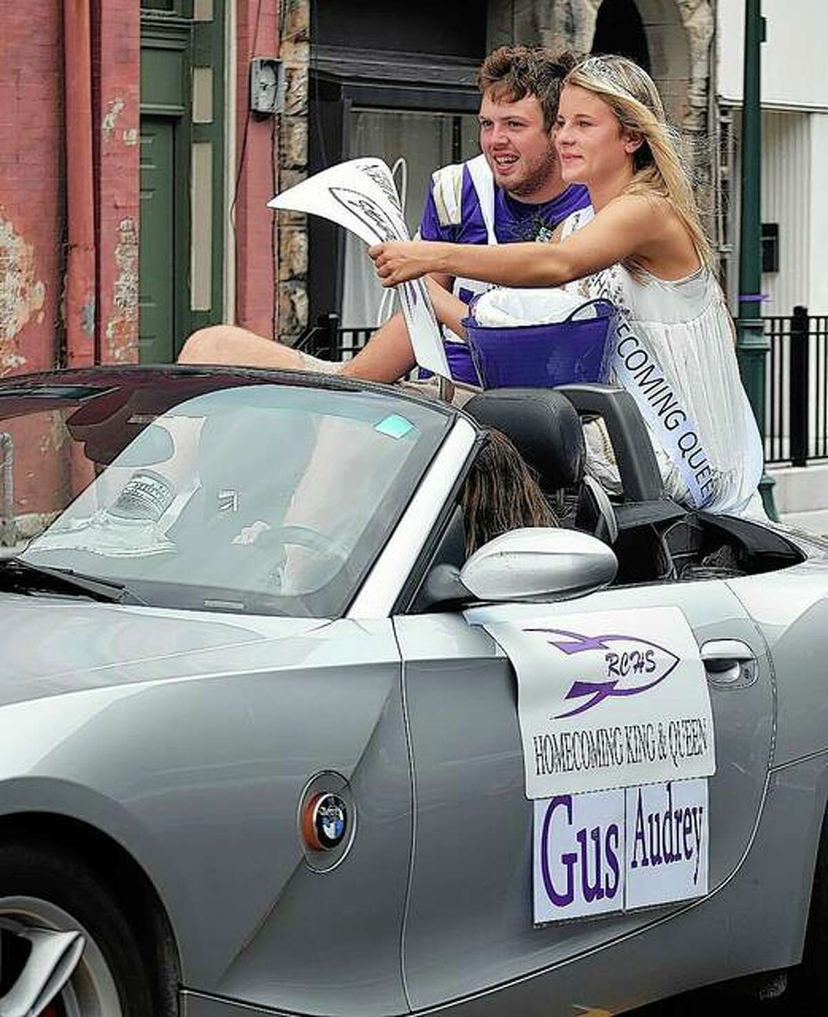 Routt Catholic High School Homecoming King Gus Abell and Queen Audrey Huffman ride Friday in Routt’s homecoming parade.
