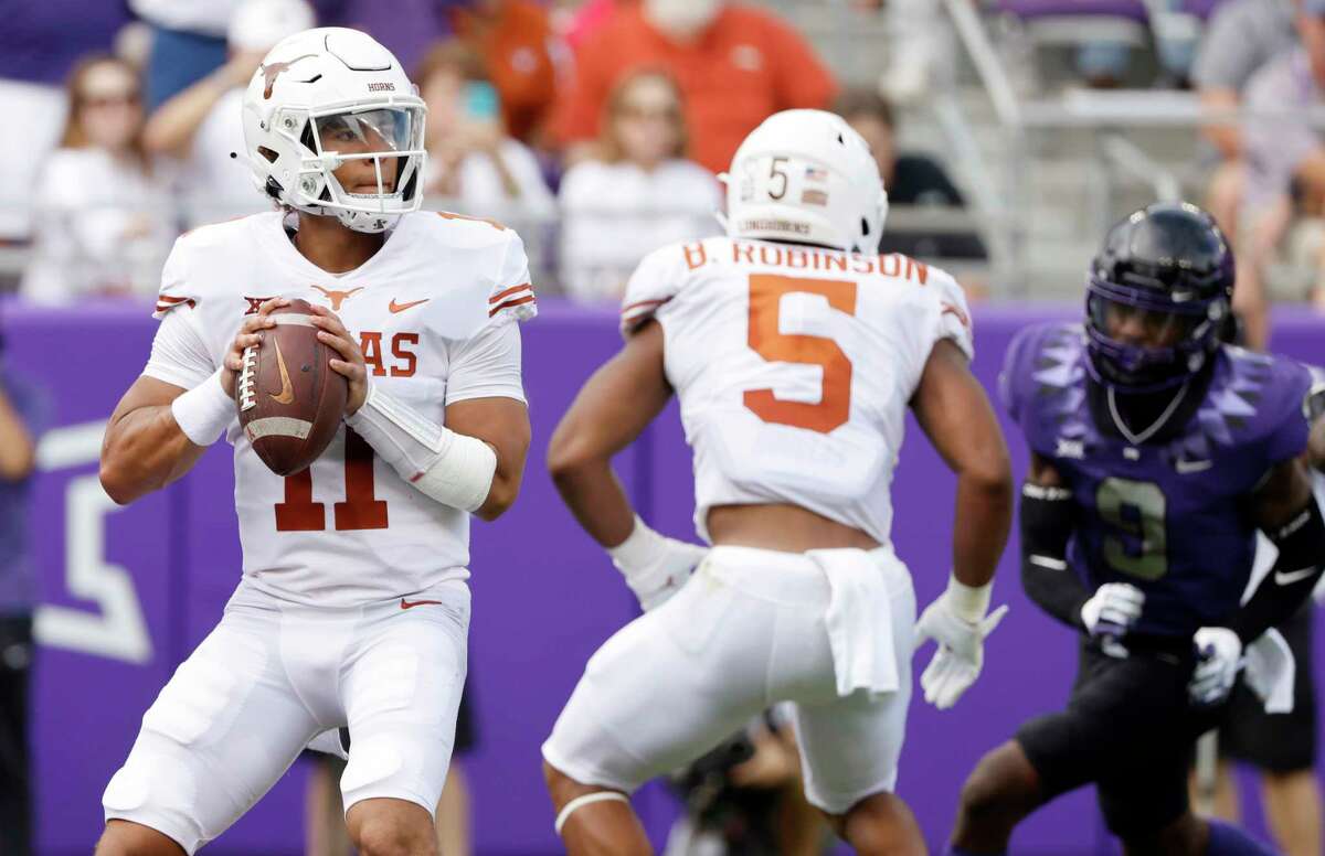 Texas quarterback Casey Thompson (11) looks to throw against TCU during the first half of an NCAA college football game Saturday, Oct. 2, 2021, in Fort Worth, Texas. (AP Photo/Ron Jenkins)