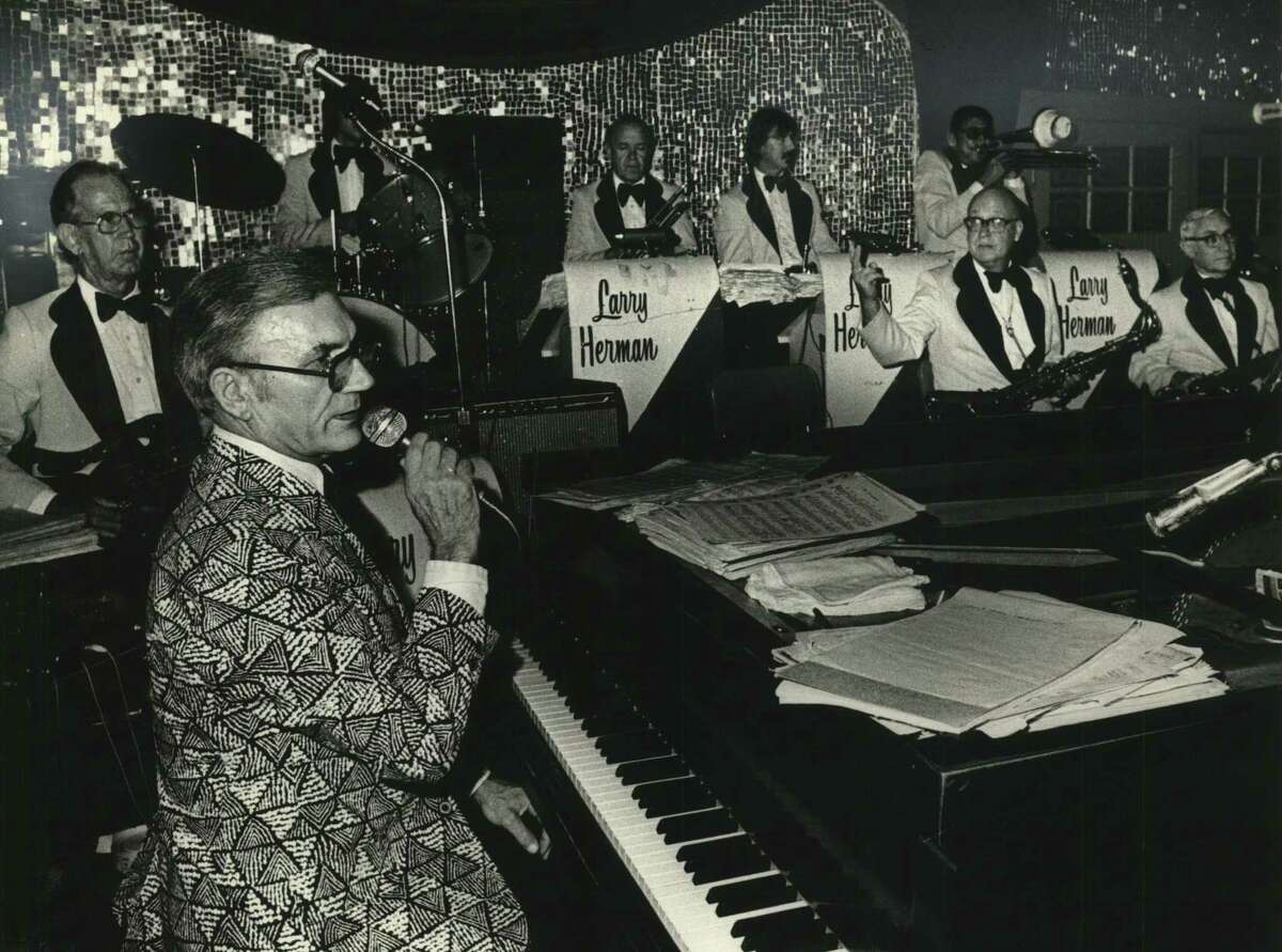 Larry Herman is shown playing the piano at his Roaring 20's nightclub.