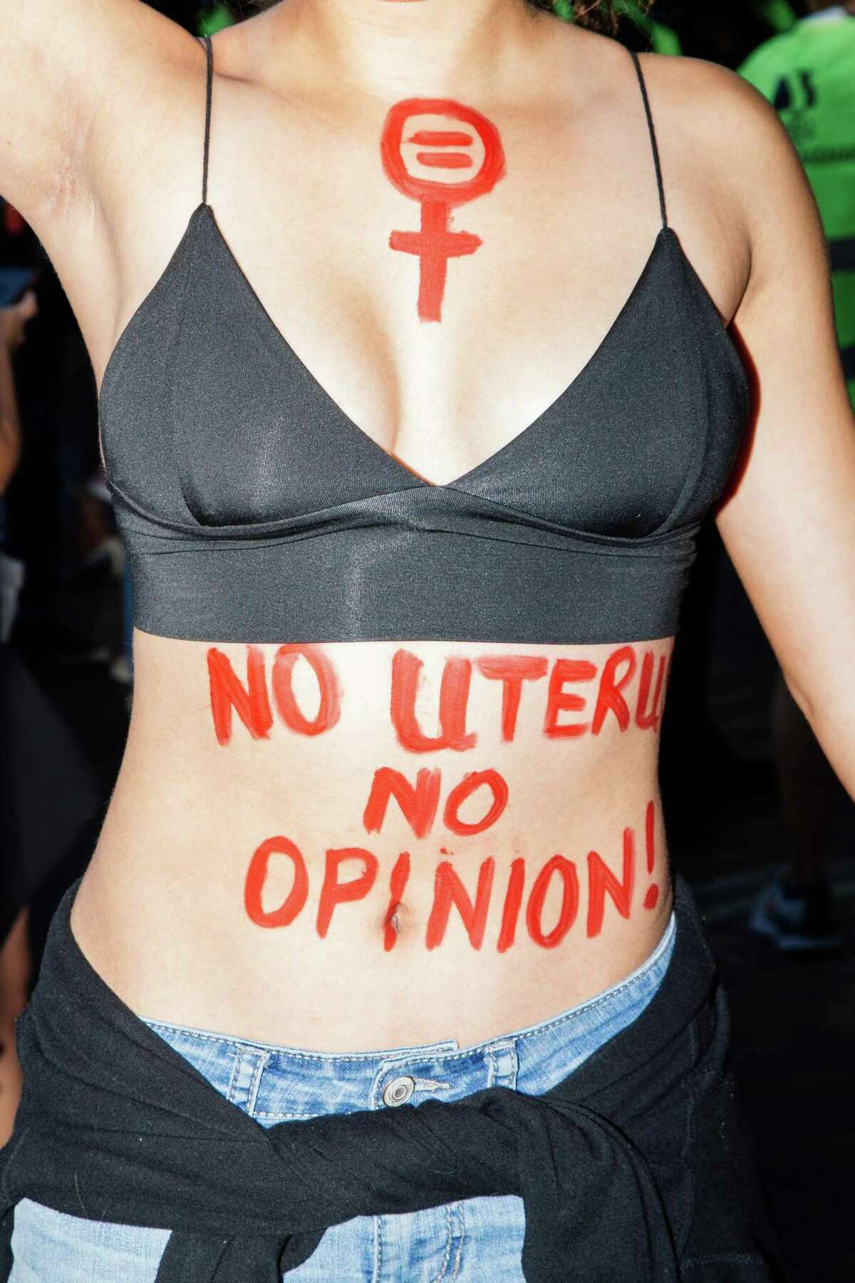 Isabella Percy, 17, wears a message on her torso at the March for Reproductive Rights in San Francisco.