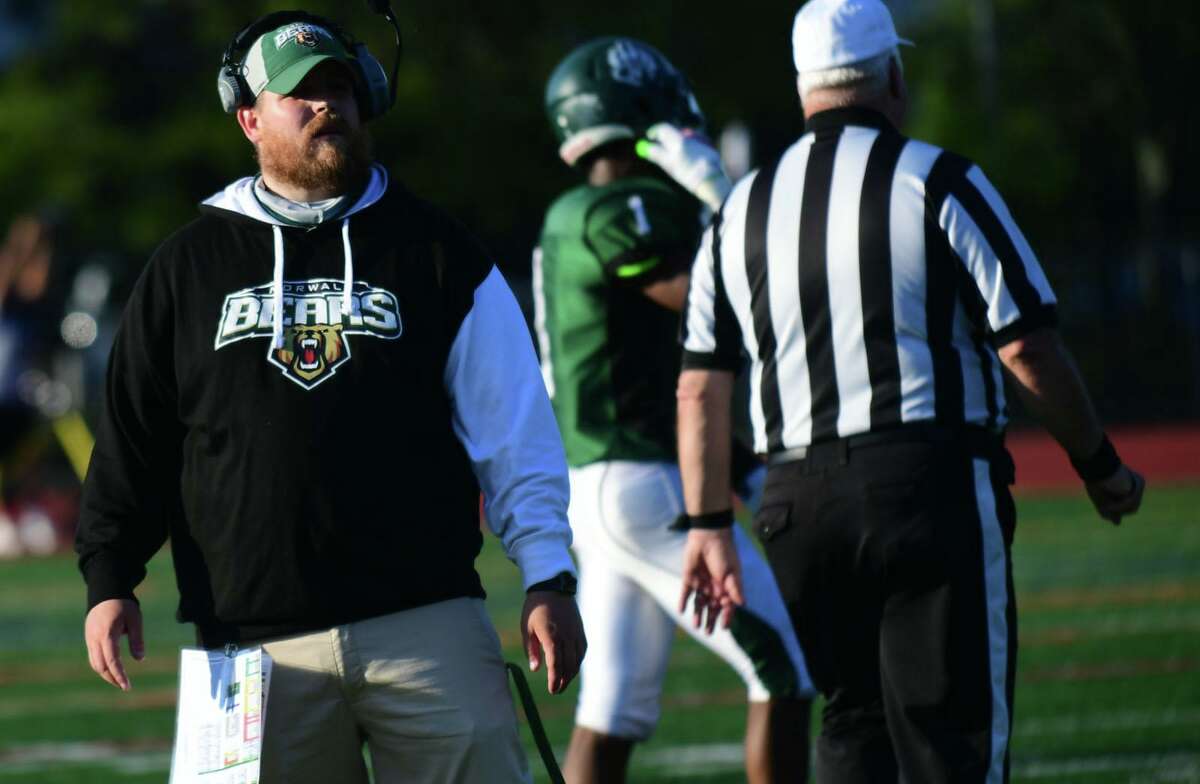 Bears new Head Coach Pat Miller leads The Norwalk High School Bears s they take on the Cheshire High School Rams during their CIAC football game Saturday, October 2, 2021, at Testa field in Norwalk, Conn.