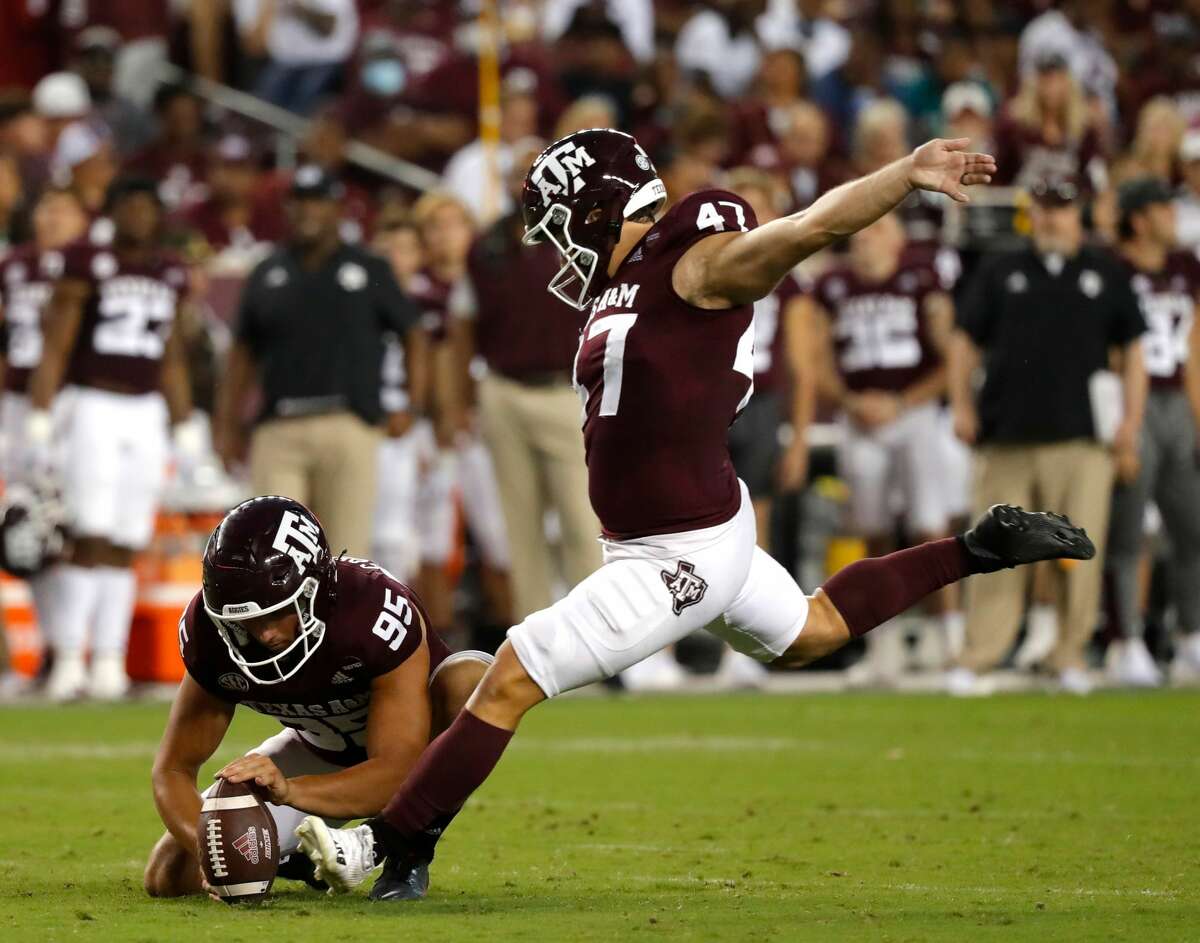 COLLEGE STATION, TEXAS - OCTOBER 02: Seth Small #47 of the Texas A&M Aggies kicks a field goal out as Nik Constantinou #95 holds in the second quarter against the Mississippi State Bulldogs at Kyle Field on October 02, 2021 in College Station, Texas. (Photo by Bob Levey/Getty Images)