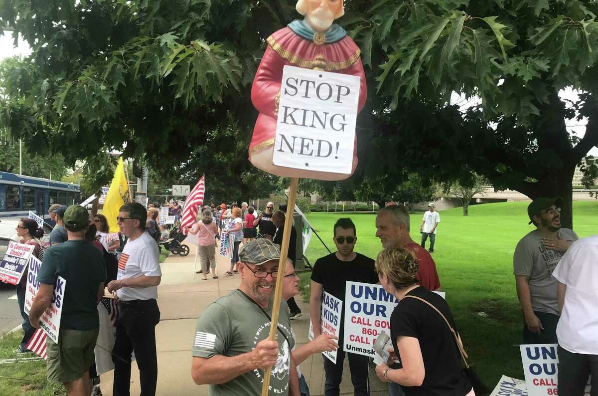 Protesters at the state Capitol on Aug. 28, 2021 opposed mask orders, vaccine mandates and the extended emergency powers of Gov. Ned Lamont, including this "Stop King Ned" sign.