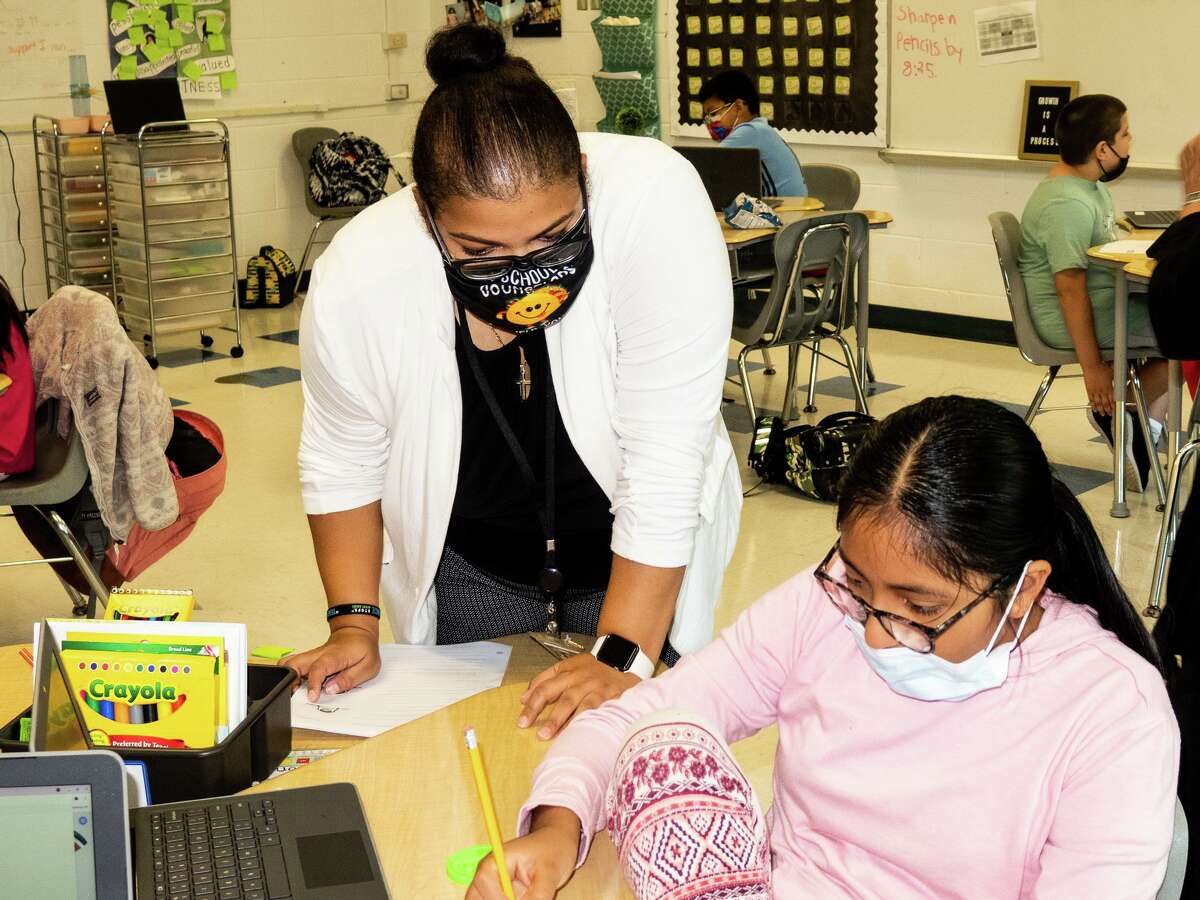 Guidance Counselor Fabiola Estevez works with Grace Moreno during the SEL lesson at Kendall School in Norwalk.