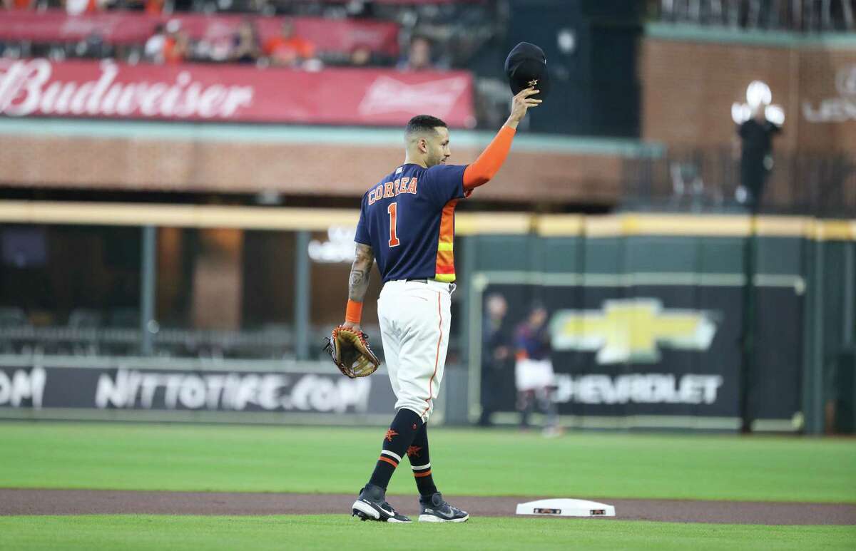 Carlos Correa (1) tips his cap to the fans in what would be his final regular season game with the Astros on October 3, 2021, in Houston.