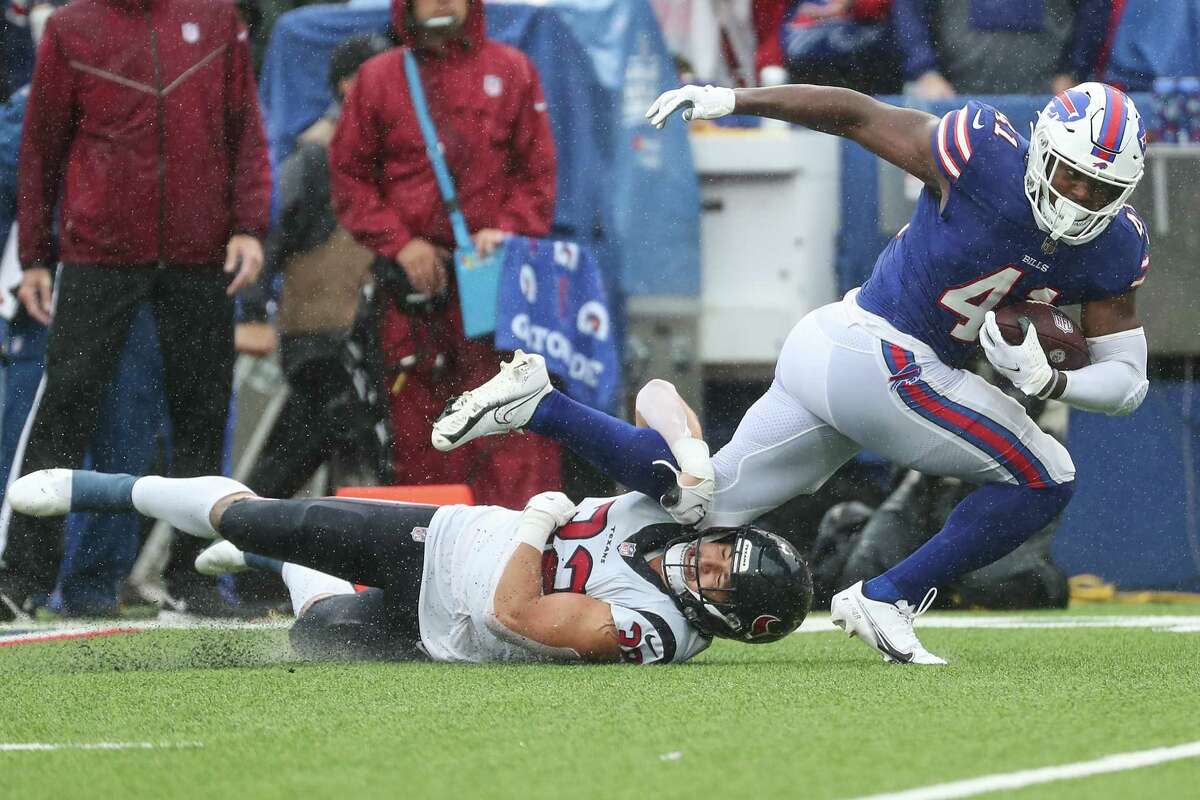 Buffalo Bills fullback Reggie Gilliam (41) is brought down by Houston Texans linebacker Garret Wallow (32) after a catch during the second half of an NFL football game Sunday, Oct. 3, 2021, in Orchard Park, N.Y..