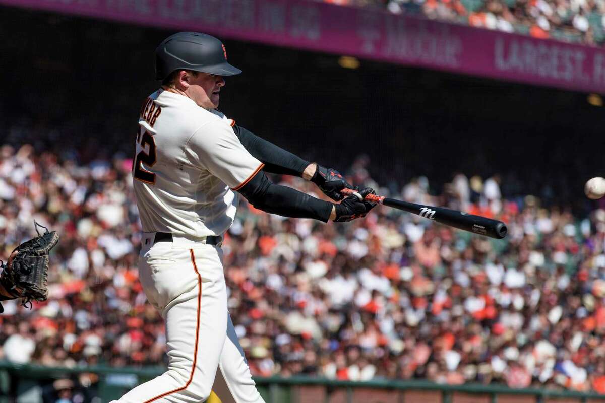 San Francisco Giants' Logan Webb hits a single against the San Diego Padres in the third inning of a baseball game in San Francisco, Sunday, Oct. 3, 2021. (AP Photo/John Hefti)