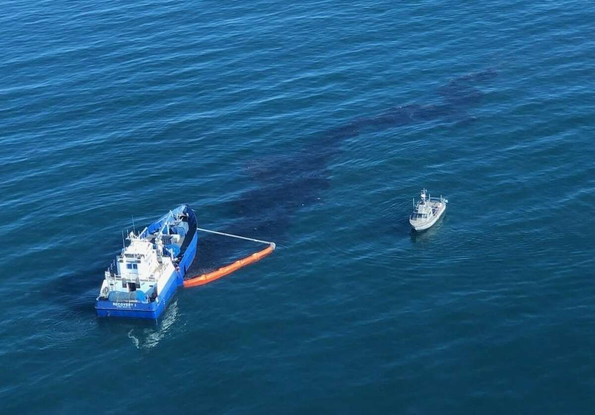 Officials from Houston-based Amplify Energy, the Coast Guard and California responding to the oil spill in October 2021.