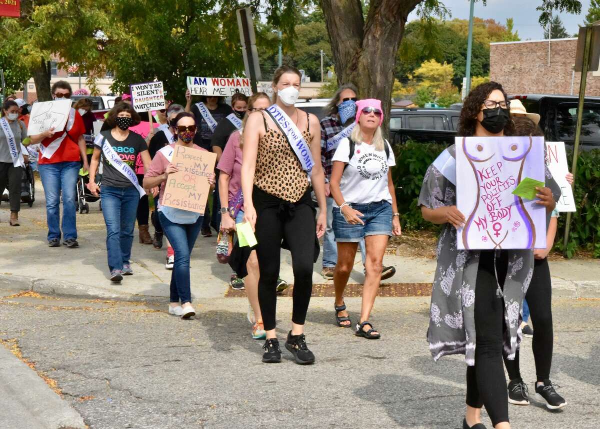 Supporters marched the streets of Big Rapids on Saturday for a Women's March. 