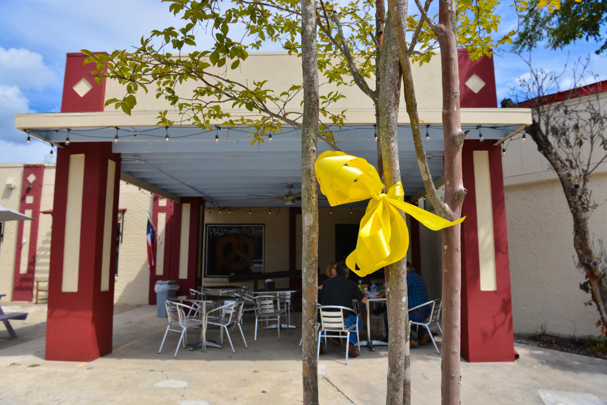 Residents cover Boerne's Main Street in yellow ribbons as a reminder of those left in Afghanistan - Vimarsana News