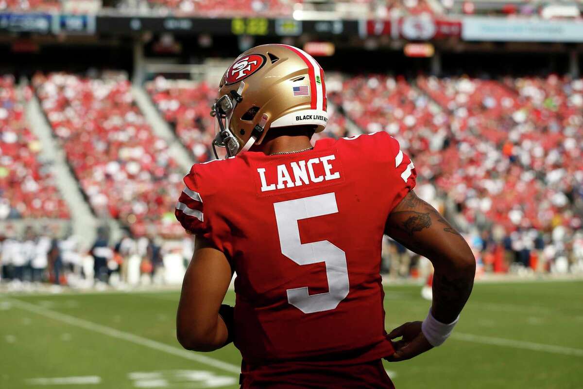 San Francisco 49ers quarterback Trey Lance (5) watches play from the sideline during an NFL football game against the Seattle Seahawks, Sunday, Oct. 3, 2021 in Santa Clara, Calif. (AP Photo/Lachlan Cunningham)