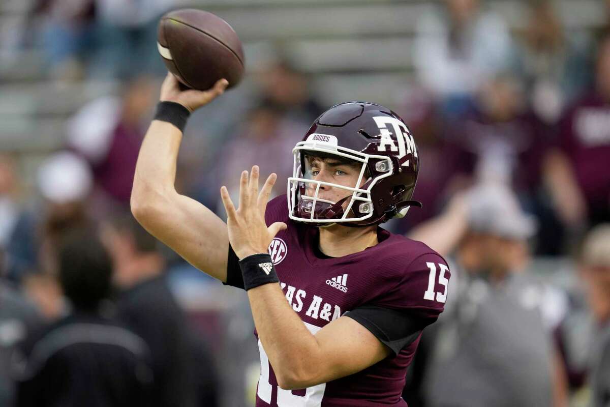 Texas A&M quarterback Conner Weigman (15) throws passes during warmups of an NCAA college football game against Mississippi on Saturday, Oct. 29, 2022, in College Station, Texas. (AP Photo/Sam Craft)