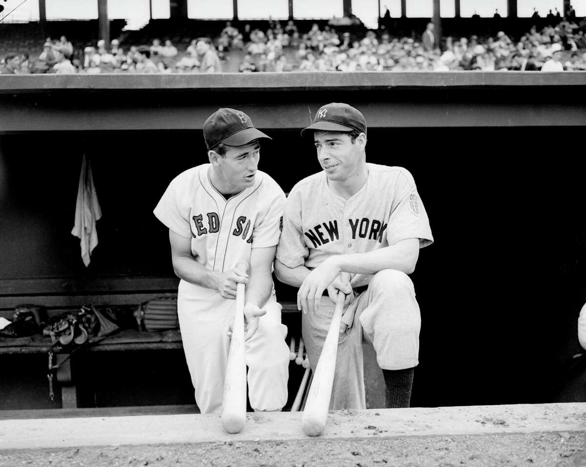 The Red Sox’s Ted Williams, left, and the Yankees’ Joe DiMaggio chat after a game on Aug. 18, 1942.