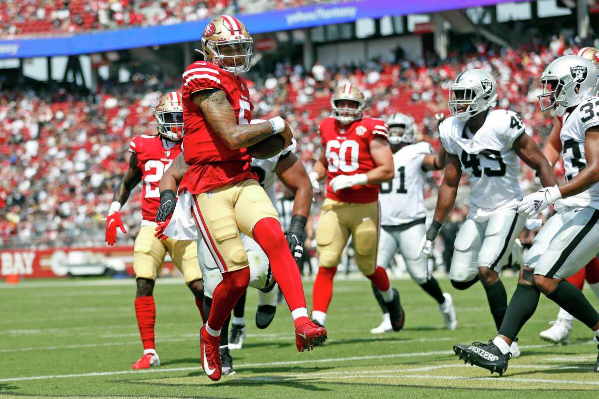 San Francisco 49ers' Trey Lance scores a 2nd quarter rushing touchdown against Las Vegas Raiders during NFL preseason game at Levi's Stadium in Santa Clara, Calif., on Sunday, August 29, 2021.