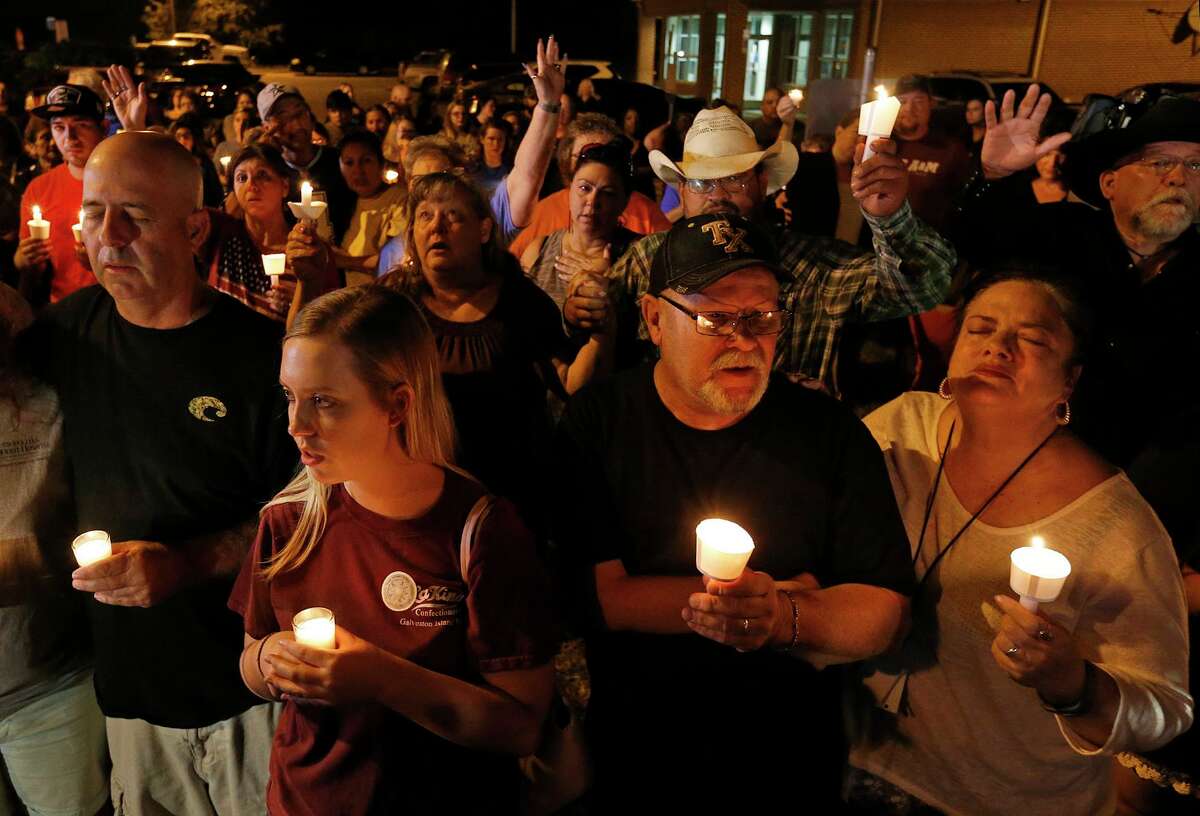 People attend a vigil for the victims of the mass shooting at the First Baptist Church of Sutherland Springs in 2017.