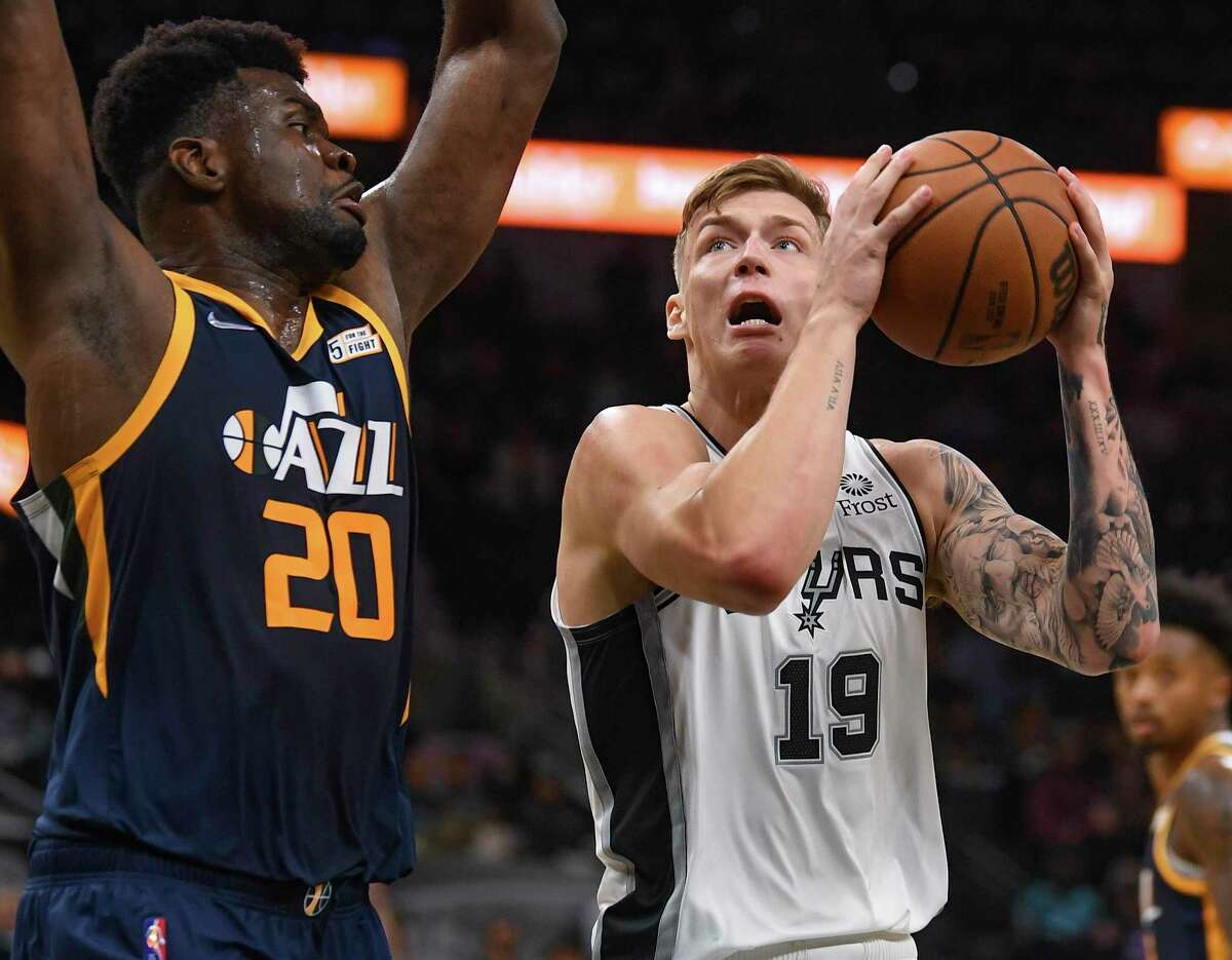 Luka Samanic (19) of the San Antonio Spurs attempts to get by Udoka Azubuike of the Utah Jazz during NBA preseason action in the AT&T Center on Monday, Oct. 4, 2021.