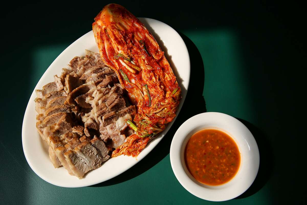 Korean suyuk, boiled pork with Napa cabbage kimchi, is on the new dine-in menu at Queens in San Francisco.
