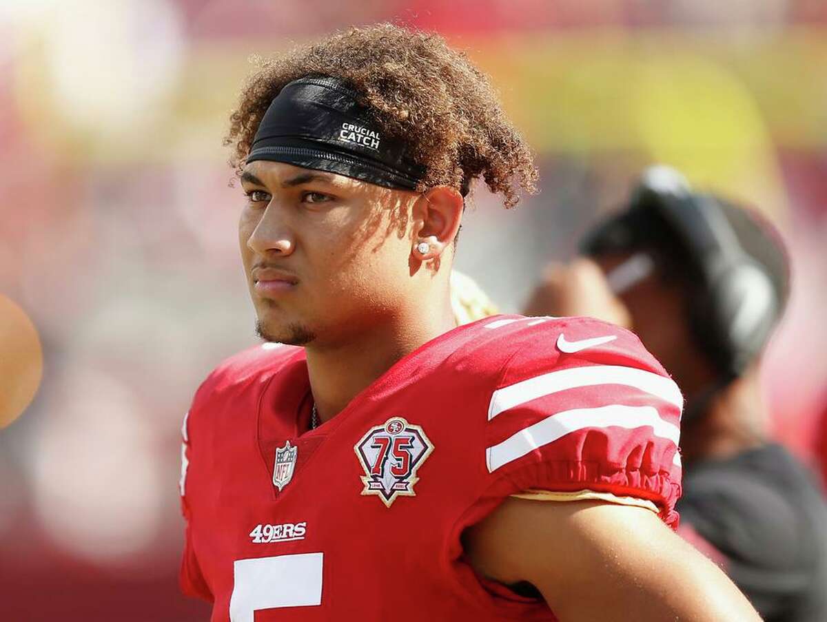 San Francisco 49ers quarterback Trey Lance warms up in a Crucial Catch shirt  before an NFL football game between the 49ers and the Seattle Seahawks in  Santa Clara, Calif., Sunday, Oct. 3