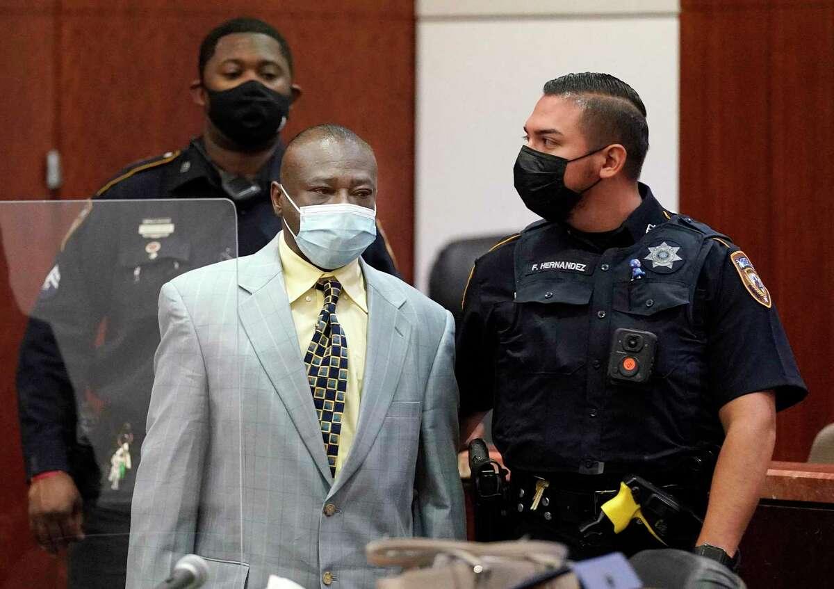 David Conley is escorted into the Harris County Criminal Court of Judge Chuck Silverman during his trial Tuesday, Oct. 5, 2021 in Houston for the murders of eight people. Valerie Jackson, her husband, Dwayne Jackson, and six children Nathaniel, 13, Honesty, 11, Dwayne Jr., 10, Caleb, 9, Trinity, 7, and Jonah, 6, were killed on on Aug. 8, 2015. Prosecutors are not seeking the death penalty.