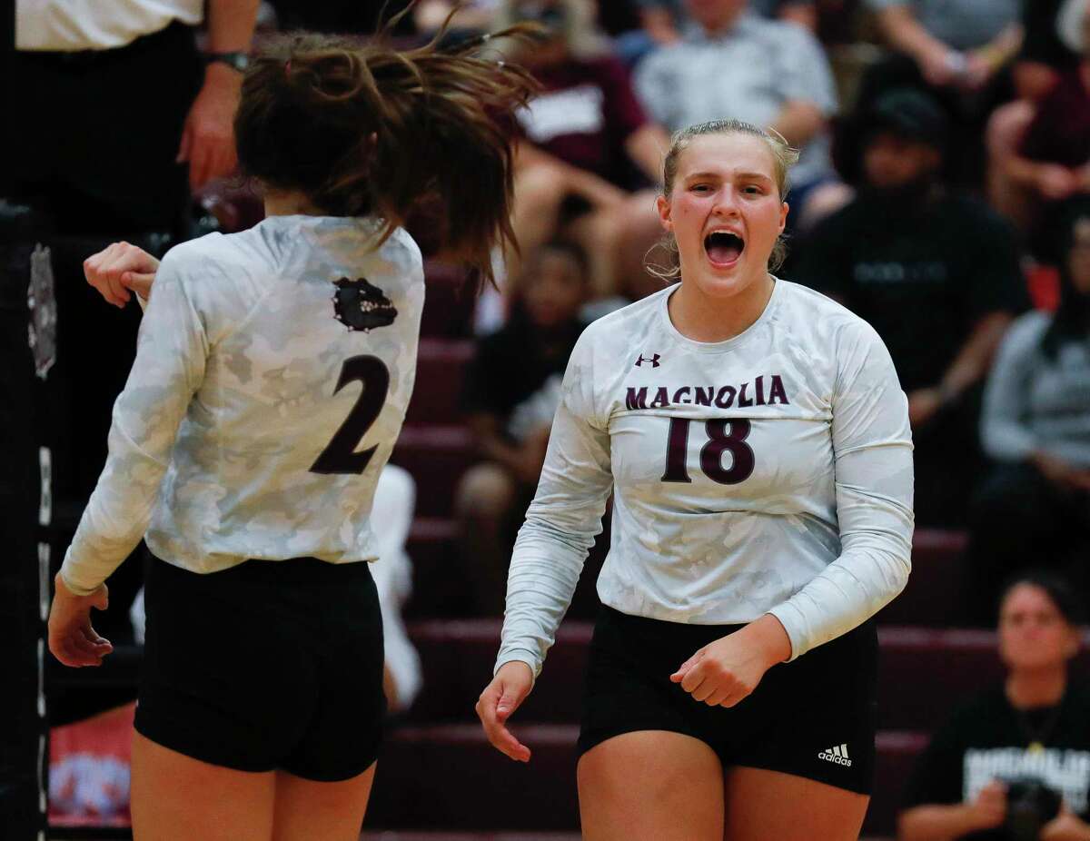 Magnolia middle blocker Brynn Botkin (18) reacts after scoring a point in the first set during a high school volleyball match at Magnolia High School, Tuesday, Aug. 24, 2021, in Magnolia.