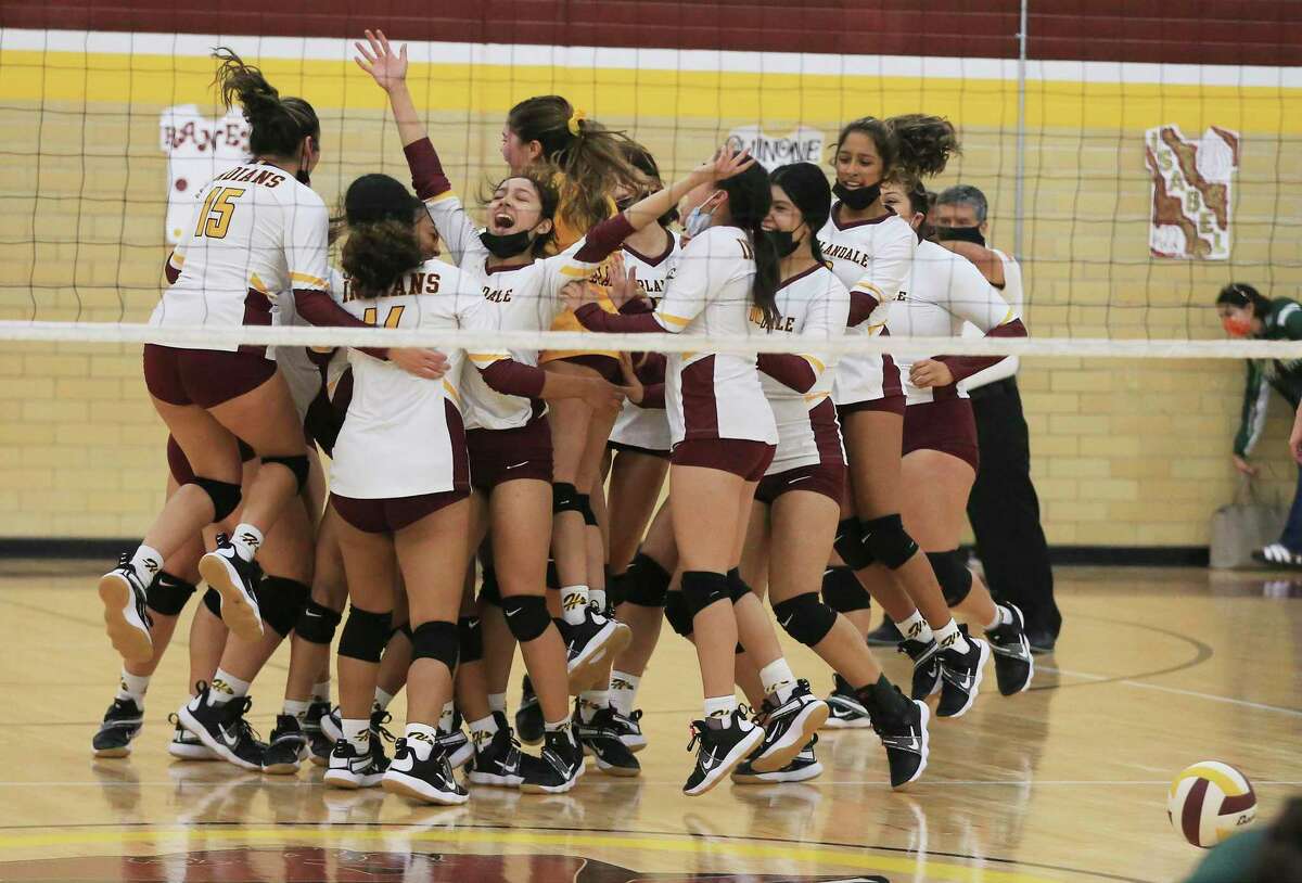 The Harlandale volleyball team celebrates after its final point against McCollum during a volleyball match on Tuesday, Oct. 5, 2021. Harlandale took the victory in three straight sets.
