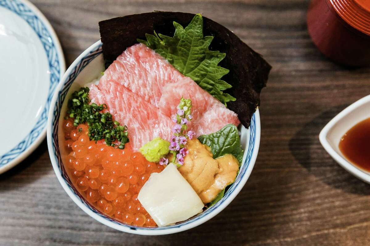 A bowl of chirashi sushi with sea urchin roe, salmon roe and fatty tuna collar, served as the rice course at Kaiseki Saryo Hachi in Burlingame, Calif.