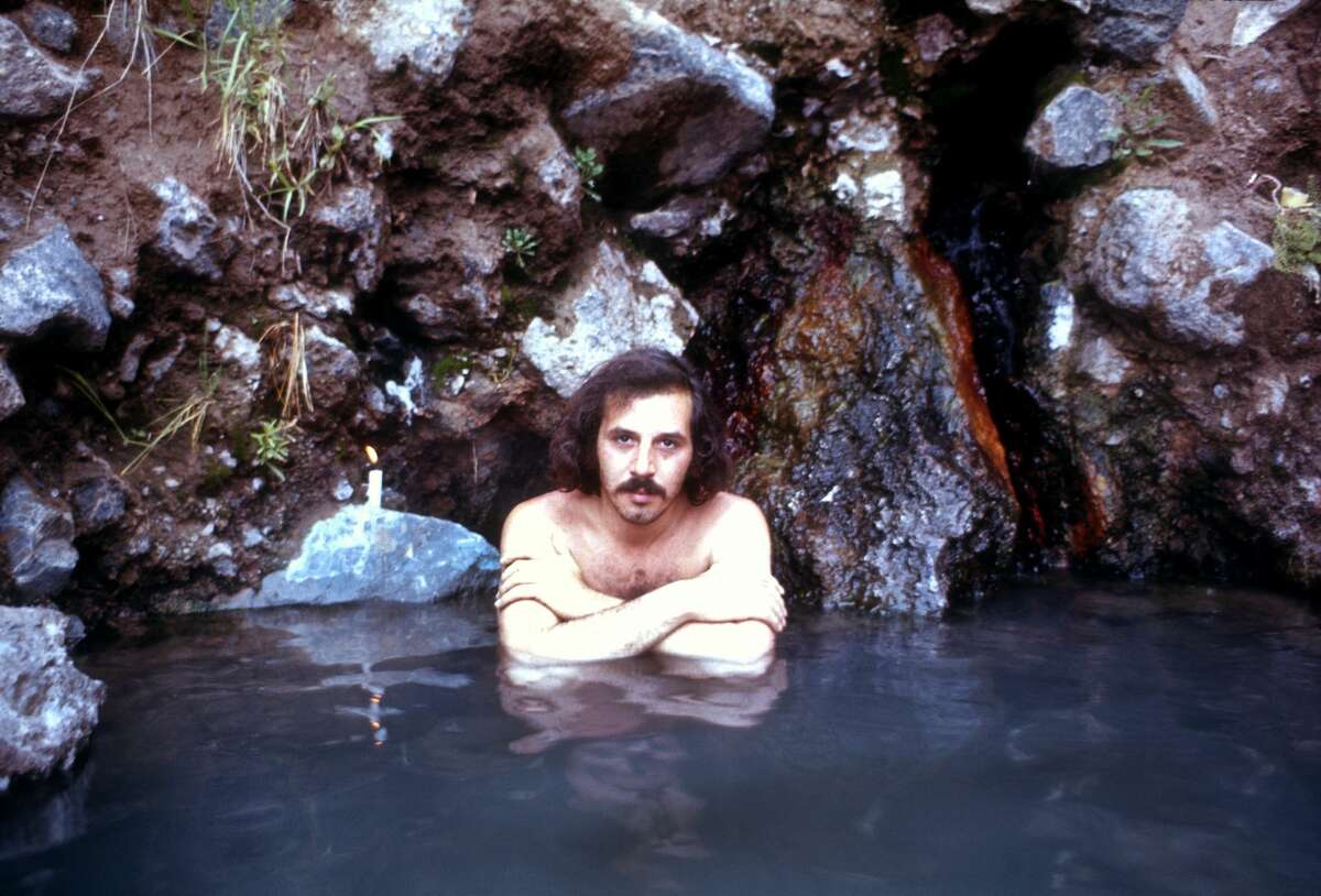 Photographer Robert Altman relaxes in the Jemez Hot Springs circa July, 1969 in Los Alamos, New Mexico.