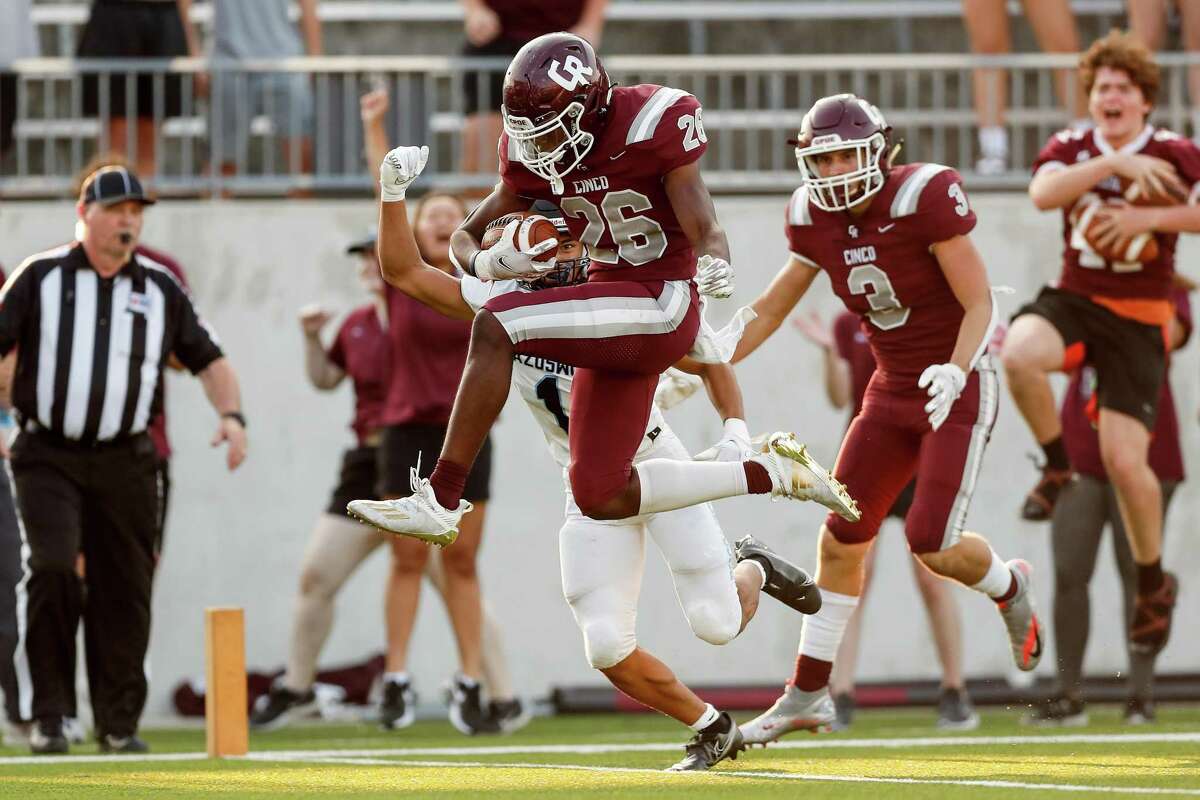Cinco Ranch Cougars running back Sam McKnight (26) leaps into the end zone for a touchdown during the first half of the high school football game between the Brazoswood Buccaneers and the Cinco Ranch Cougars at Legacy Stadium in Katy, TX on Friday, September 10, 2021. The Cougars lead the Buccaneers 34-7 at halftime.