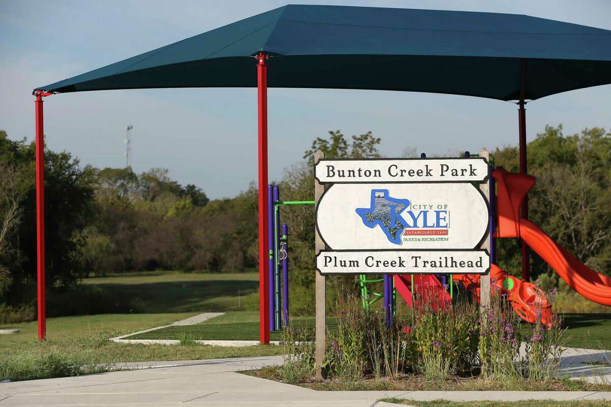 A sign marks the Plum Creek Trailhead on Monday in Kyle.