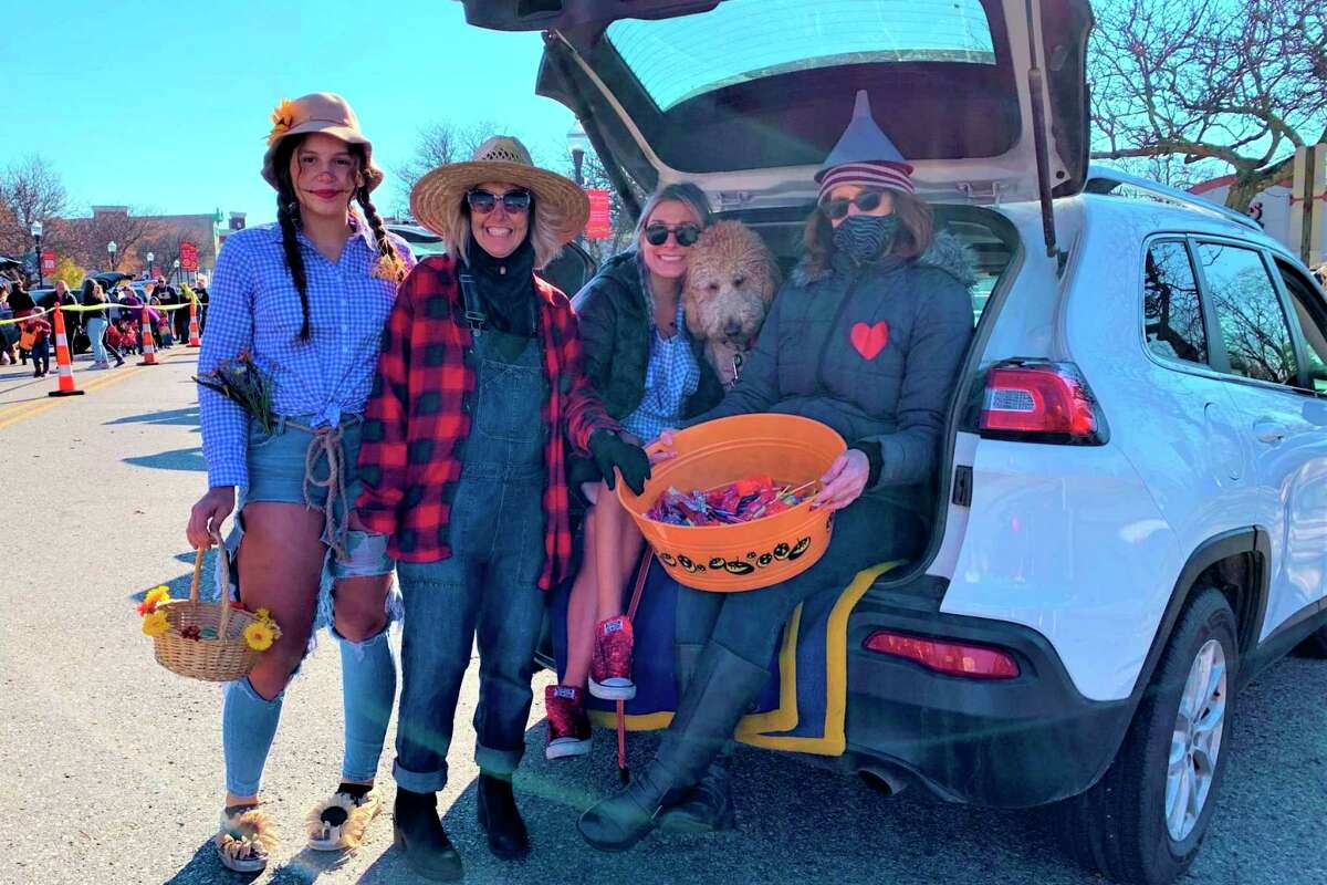 In this Oct. 31, 2020, Pioneer file photo, Trunk or Treat participates take a break from passing out candy to flash a few smiles to the camera. This year's Trunk or Treat is scheduled to run from noon to 2 p.m. Saturday, Oct. 30. (Pioneer file photo)