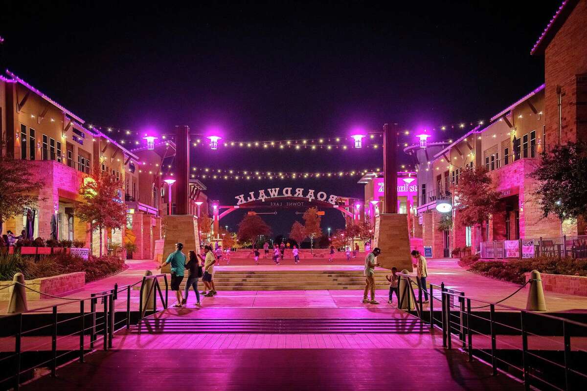 The Boardwalk at Towne Lake in northwest Houston is awash in pink with lights recognizing Breast Cancer Awareness month this October.