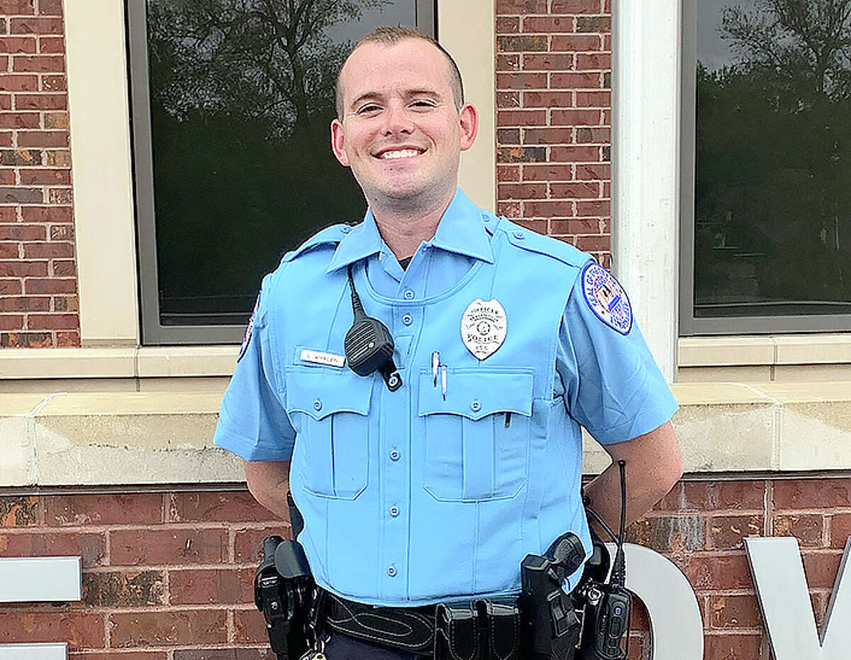 Luke Whalen in front of the Edwardsville Public Safety Building Tuesday. He joins the Edwardsville Police Department as its newest officer, after garnering experience as a police explorer for a year. 