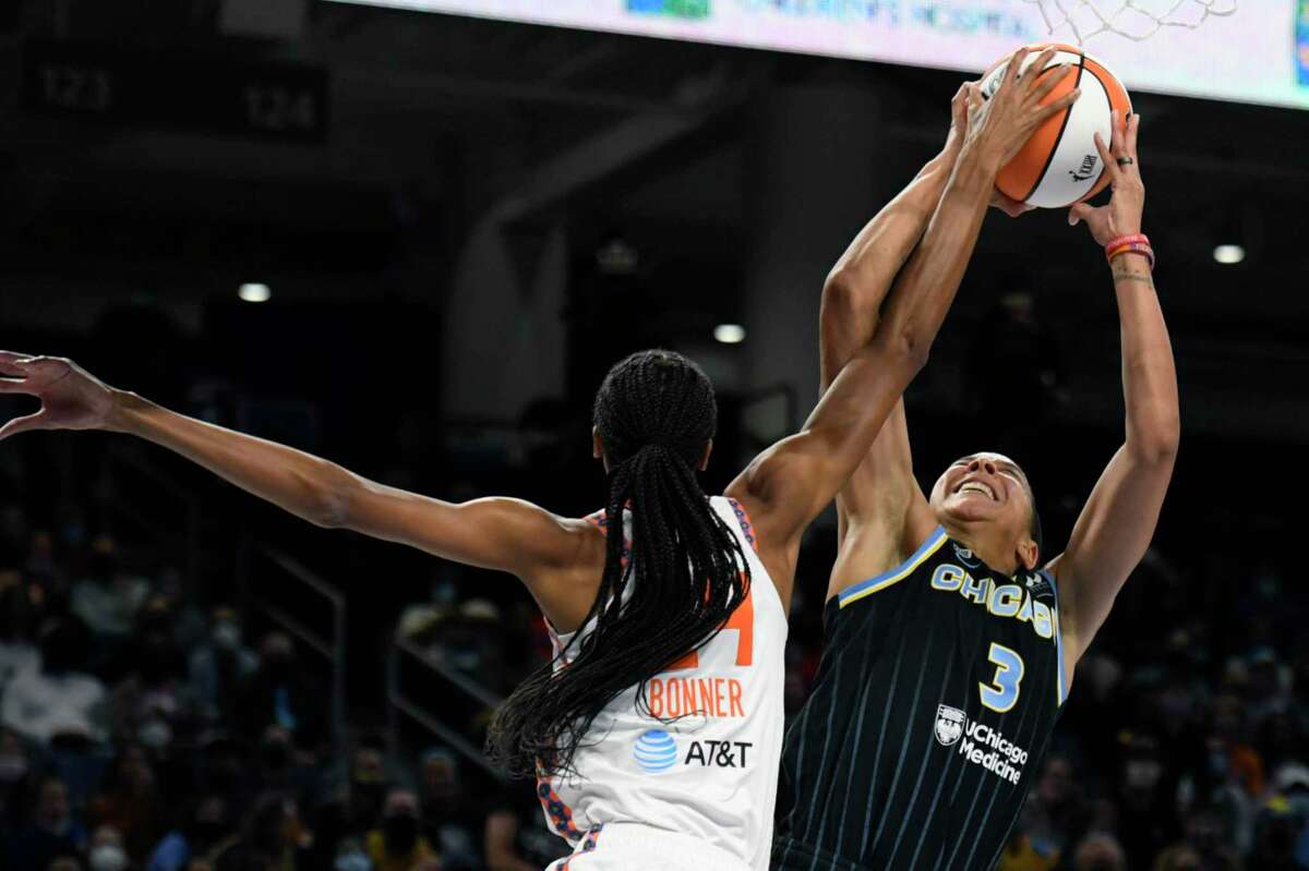 Chicago Sky’s Candice Parker (3) shoots while being fouled by Connecticut Sun’s DeWanna Bonner during the first half of Game 4 of a WNBA basketball playoff semifinal on Wednesday in Chicago.