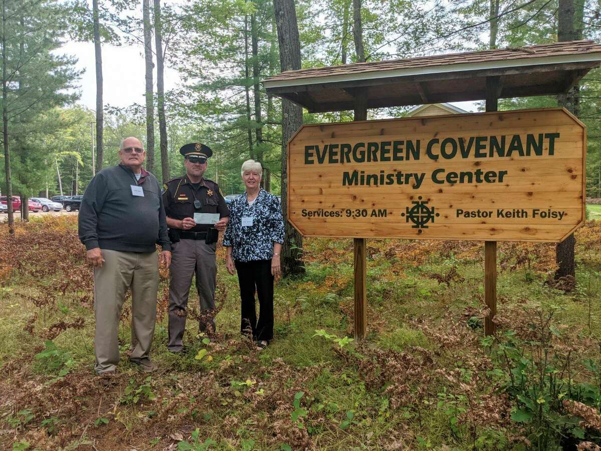 Lake County sheriff Rich Martin presents a check for $1,000 to Evergreen Covenant Church as part of the ongoing Sheriff's Charitable Campaign. (Submitted photo)