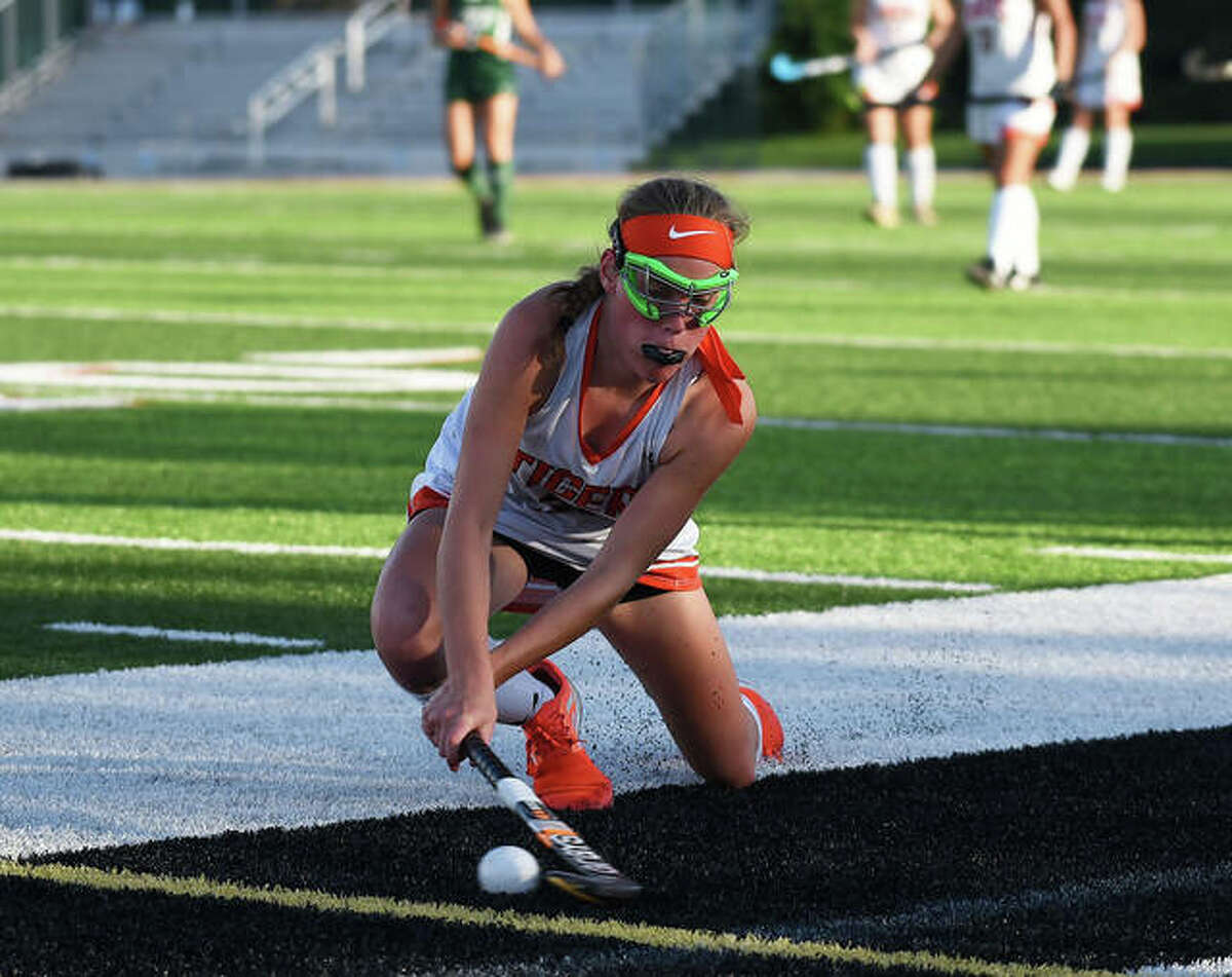 Edwardsville’s Morgan Angle swipes a pass down the field during the fourth quarter.